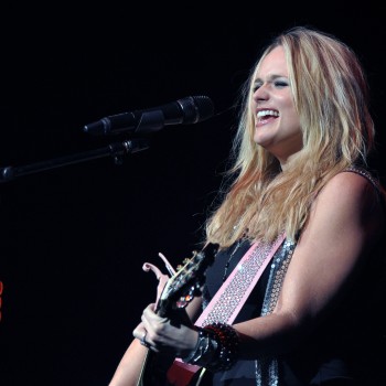 Miranda Lambert rocking and singing into the microphone.